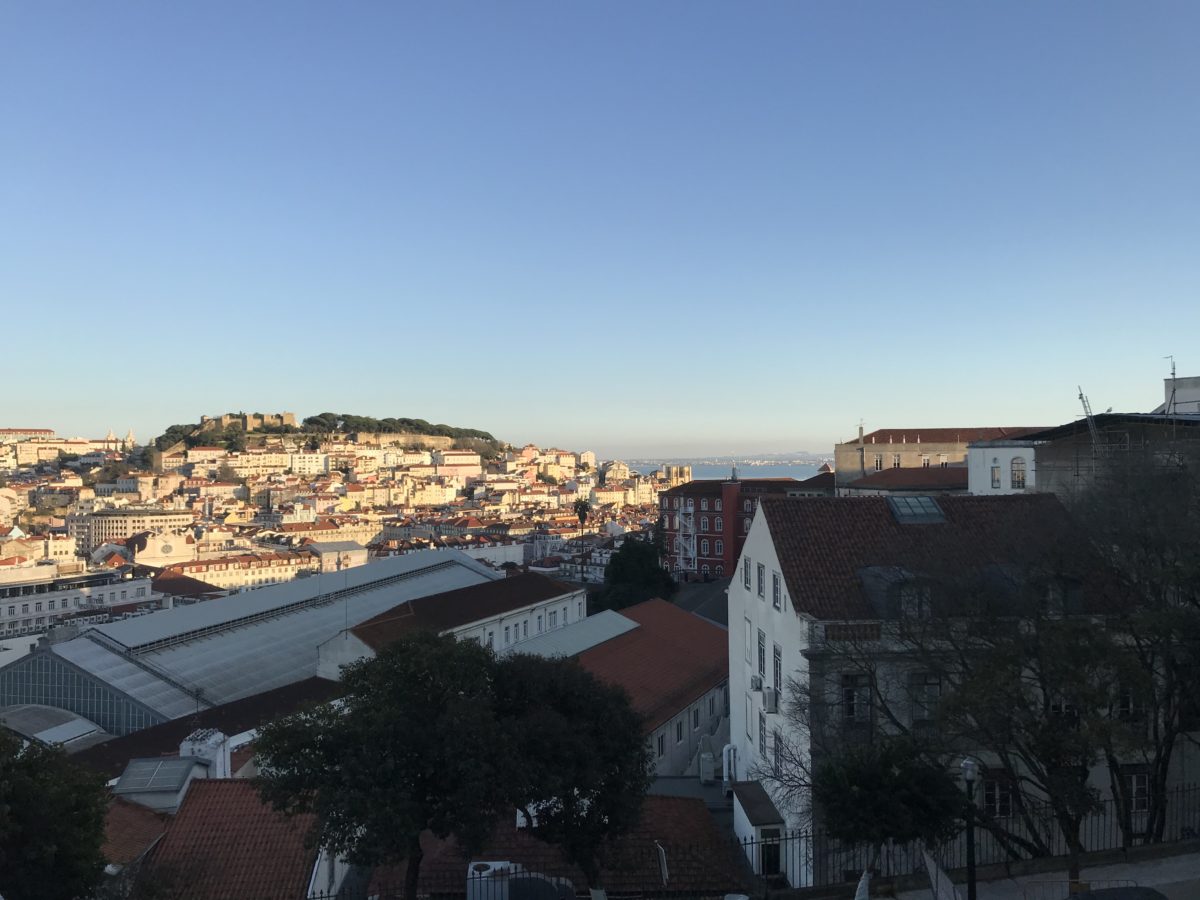 Miraduoro de São Pedro de Alcântara with the view on the castle hill and the Atlantic. Lisboa
